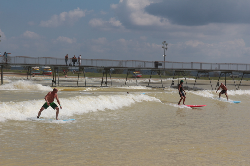 Surfers enjoying the surf park waves 300 miles from any large body of water.